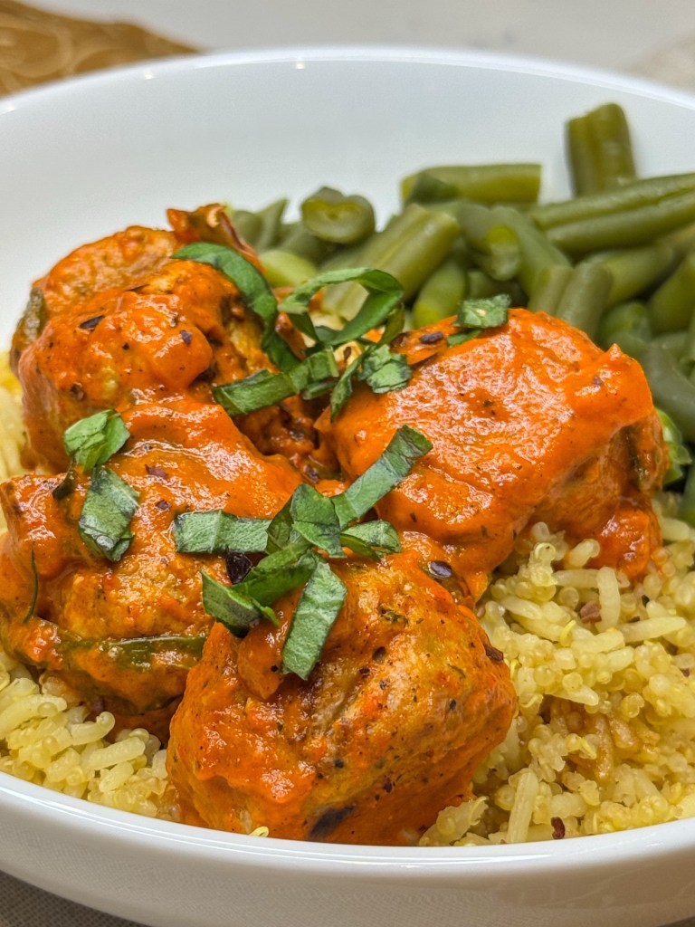 Meatballs in red pepper sauce close