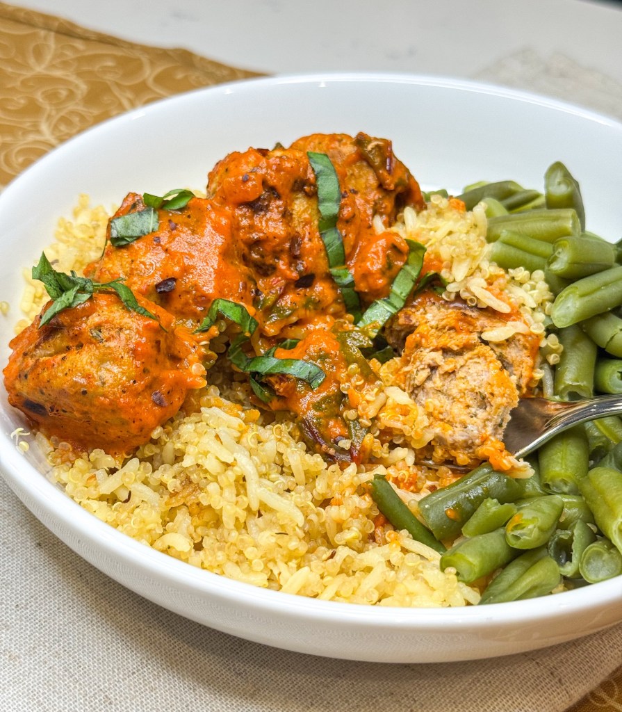 Meatballs in red pepper sauce bite