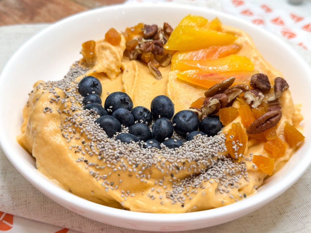 Creamy orange foods smoothie bowl